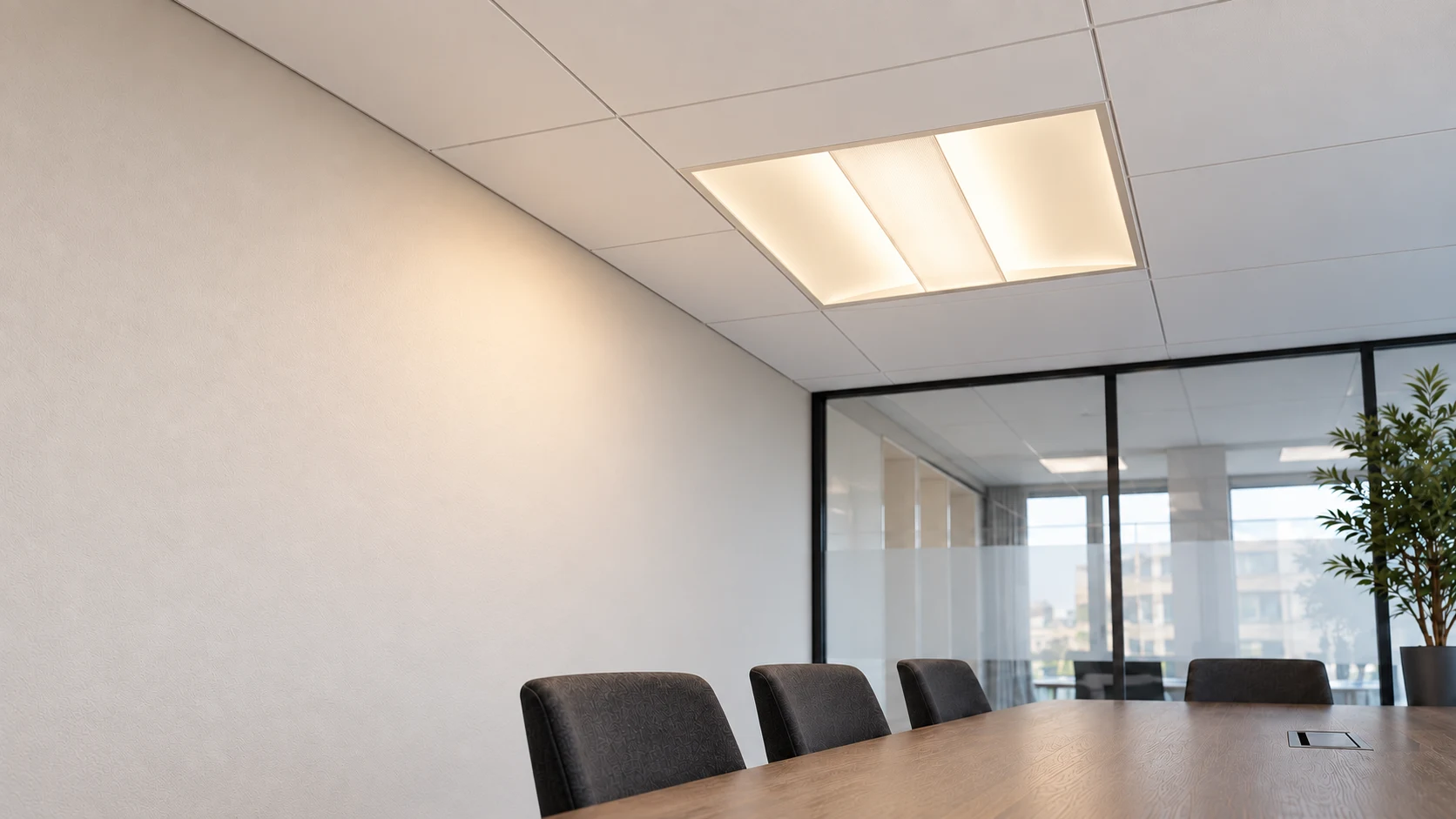 Luminate in an illustrative meeting-room setting with warm white illumination