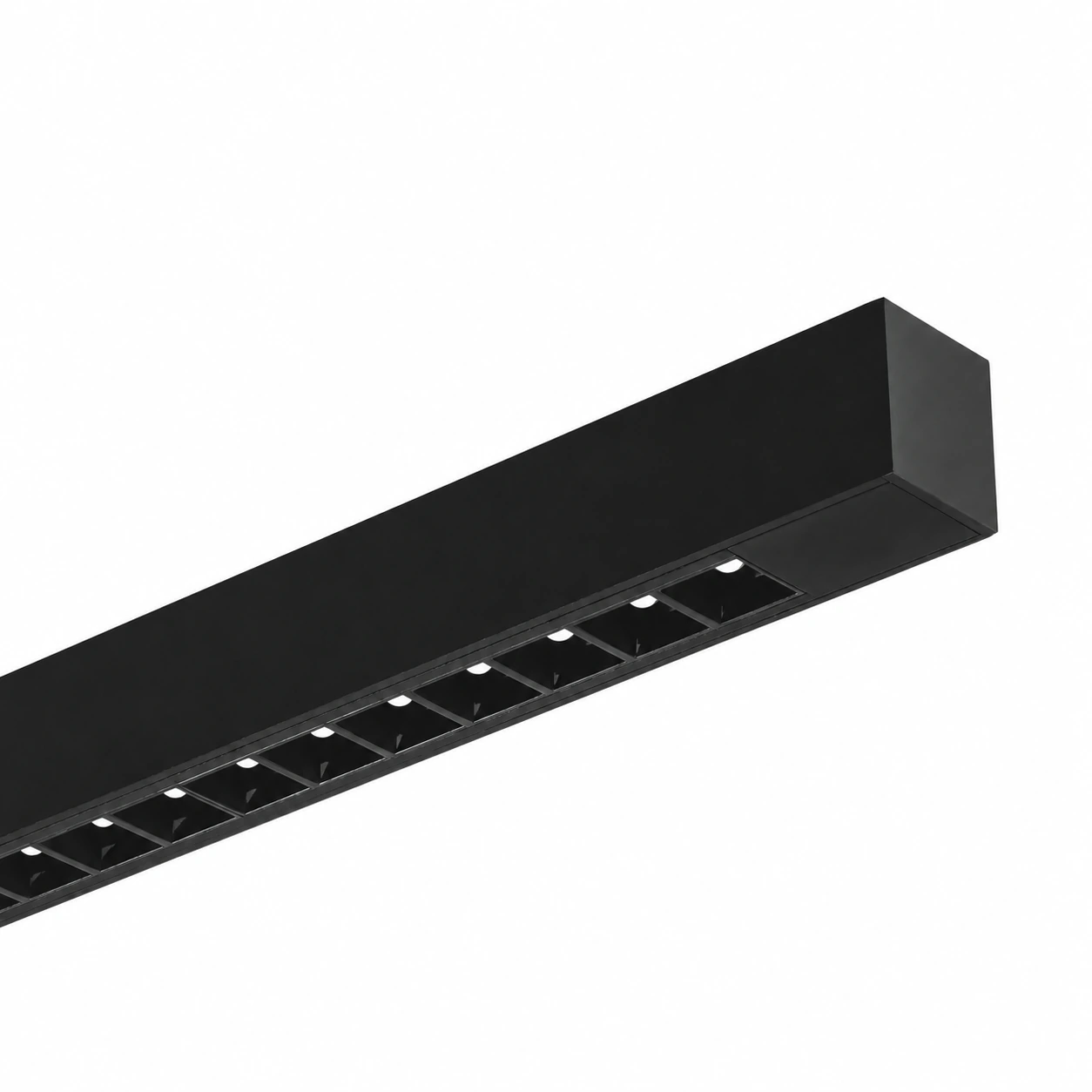 Luma suspended linear luminaire with black body and dark-light optic on a white background