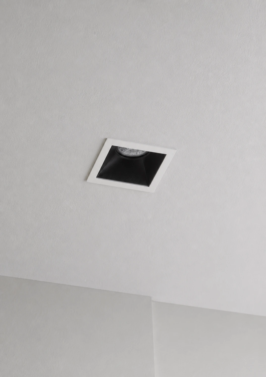 Guard shown in a commercial lighting application